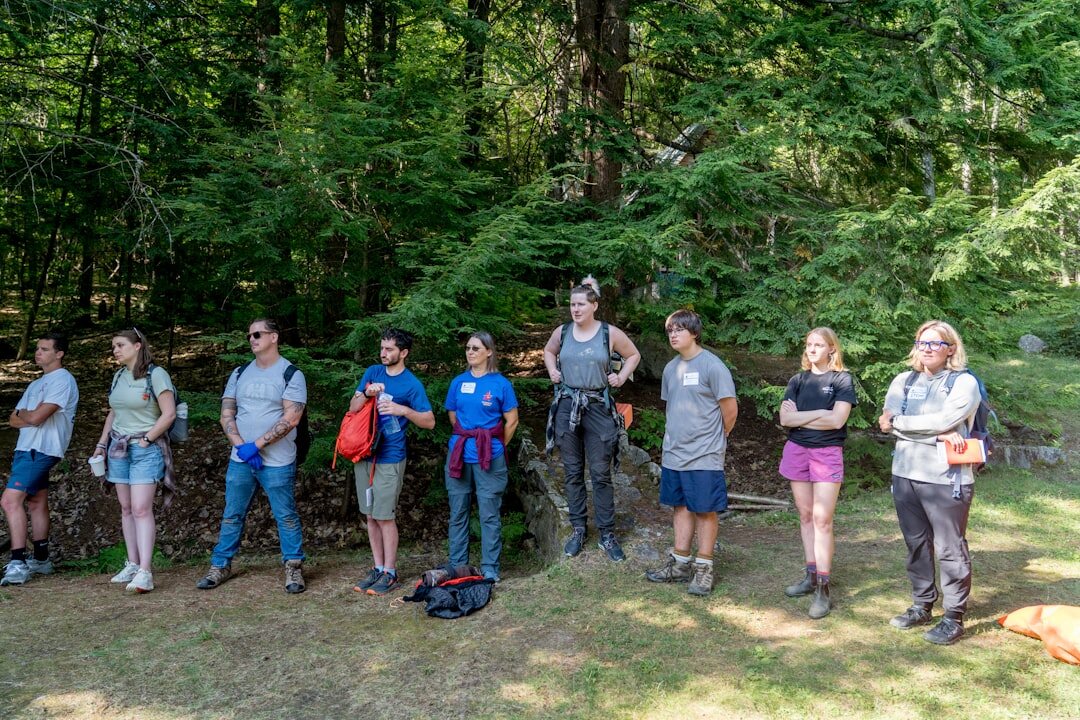 Team of center staff and instructors standing together smiling