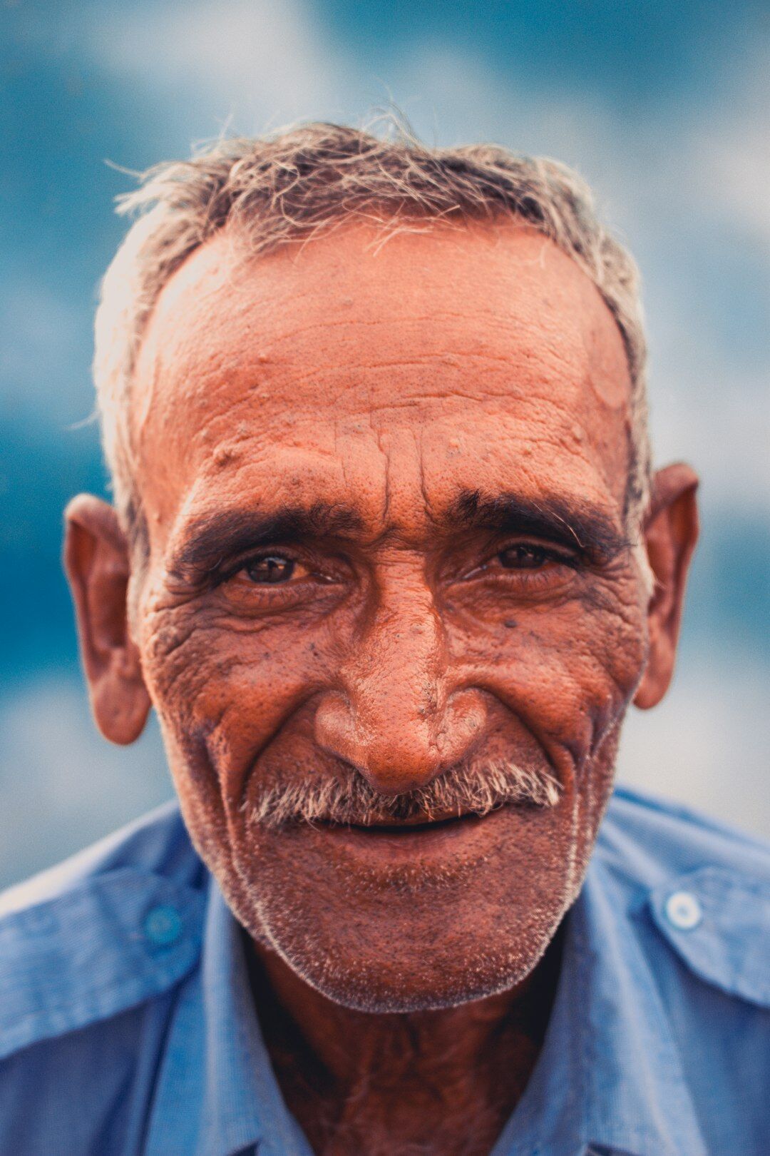 Portrait of a smiling senior man named Hans